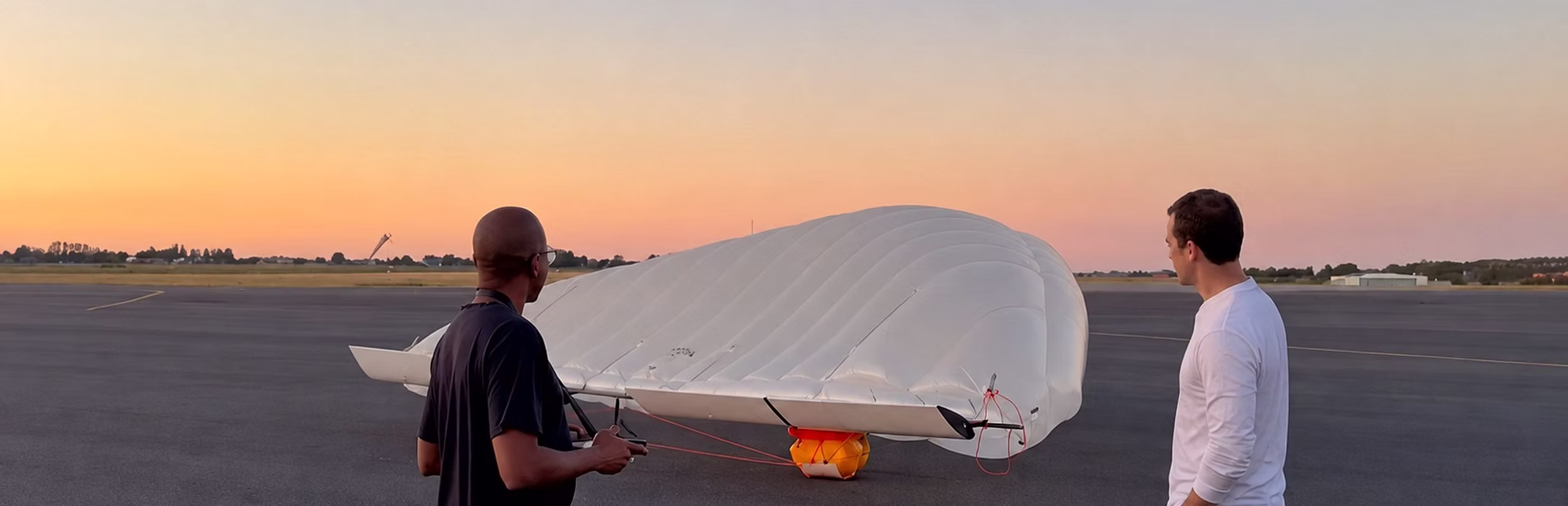 Olivier Manette and Benjamin Degasne with the Celeste aircraft prototype at sunset